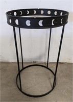 Metal table base with moon phase cut out accents