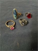 Four costume jewelry rings three of them are