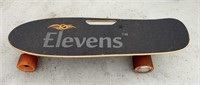 Elevens Electric Skateboard in Garage