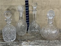 4 pretty glass decanters - wrong stopper on 1