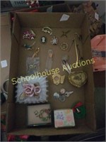 Flat of jewelry and brooches and boxes