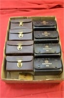 (8) Ambassadeur reels in leather pouches