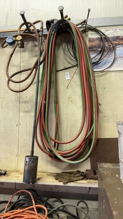 Lot of extension cords and air hose