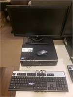 HP PC with mouse, keyboard, and monitor