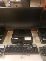 HP PC with mouse, keyboard, and monitor