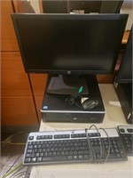 HP PC with mouse, keyboard, and monitor