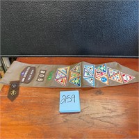 Girl Scout sash with pins & patches