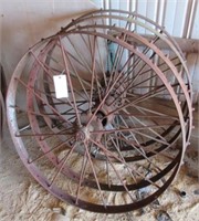 (4) Antique steel wheels. Measures 44" diameter.