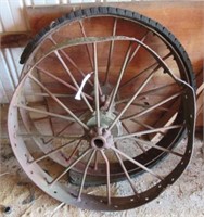 (2) Antique steel wheels. Measures 41" diameter.