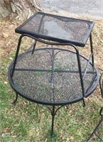 Lawn furniture - two black rod iron tables.