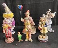 Group of clown figurines in a box