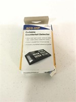 Portable counterfeit detector