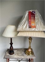 Two table lamps, one brass lamp with two matching