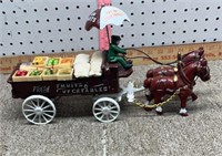 Cast iron groceries wagon and horses