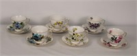 GROUP OF TEA CUPS AND SAUCERS