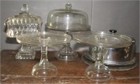 3 plain glass cake stands, one with glass