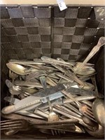 large basket of silver plated flatware