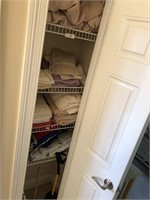 Closet full of towels and bedding