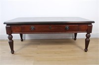 CHERRY STAINED WOODEN COFFEE TABLE WITH DRAWER