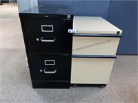 Two metal filing cabinets all drawers work one is