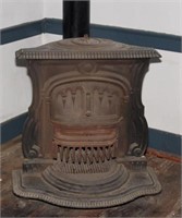 Cast iron wood or coal stove. Top marked
