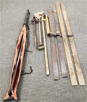 Group including wooden skis, primitive tools