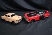 Two vintage tin toy cars