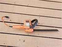 Electric Black and Decker hedger working