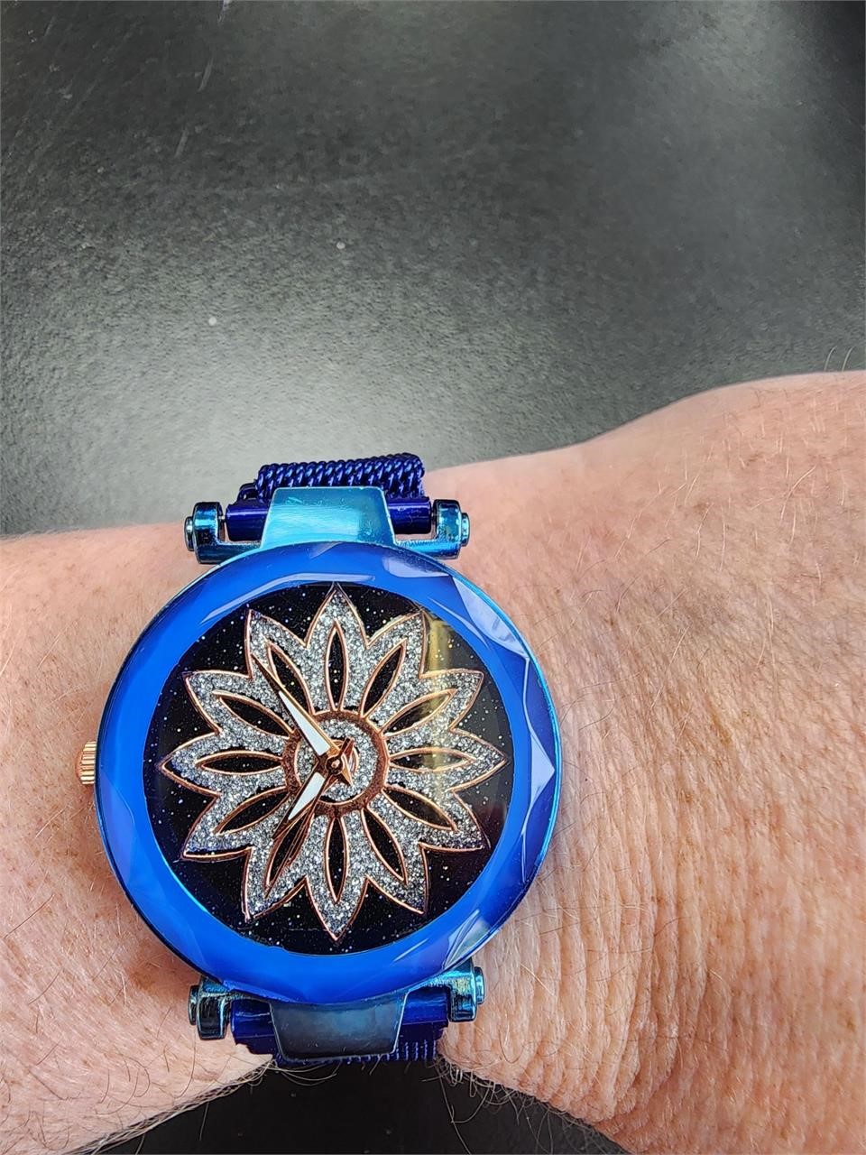 Metal watch with magnetic strap