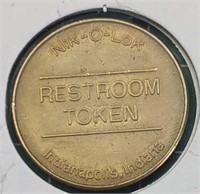 Token nik-o-lok restroom token