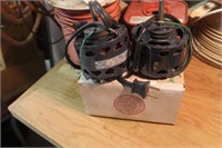 two small black electric motors