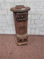 Antique wood stove. Yard art or planter