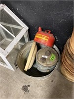 Metal cans and a planter.