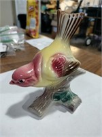 Ceramic bird on branch