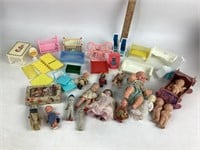 Miniature dolls and plastic dollhouse furniture: