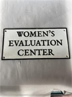 Cast iron, Women’s Evaluation Center, sign