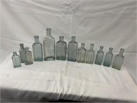 12 Vintage Light Blue Embossed Bottles