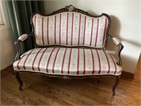 ANTIQUE SETTEE WITH CARVED BACK ARMS AND LEGS