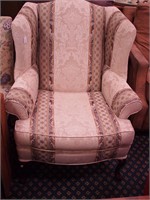 Upholstered highback wingback chair with
