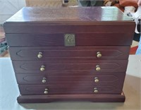 A large wooden jewelry box