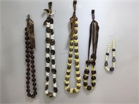 Assorted bead and shell necklaces.