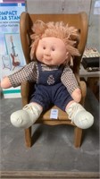 Stuffed doll and wooden chair, 19 “  tall 8 1/2 “