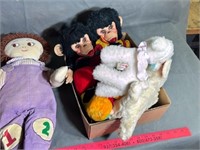 Two boxes of dolls and stuffed animals