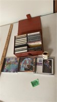 Cassettes in holder and CDs