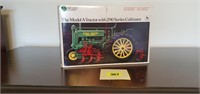 John Deere toy Model A tractor with cultivator