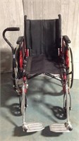 Red Invacare wheelchair