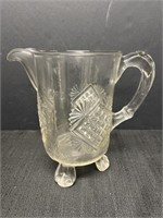 Unique footed glass pitcher, 9in tall