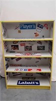 PAINTED YELLOW SHELF WITH MOTORSPORT STICKERS