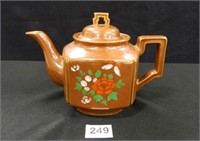 Teapot w/floral design; spout is chipped
