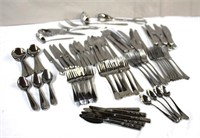 Assorted flatware & serving pieces in plastic